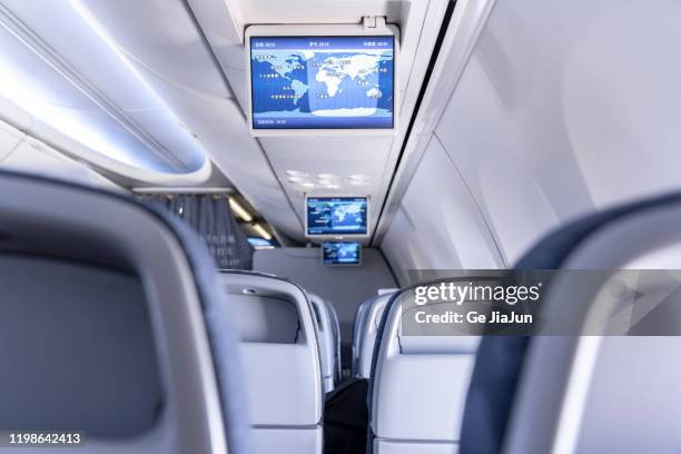 multimedia equipment on the plane - flugzeugsitz stock-fotos und bilder