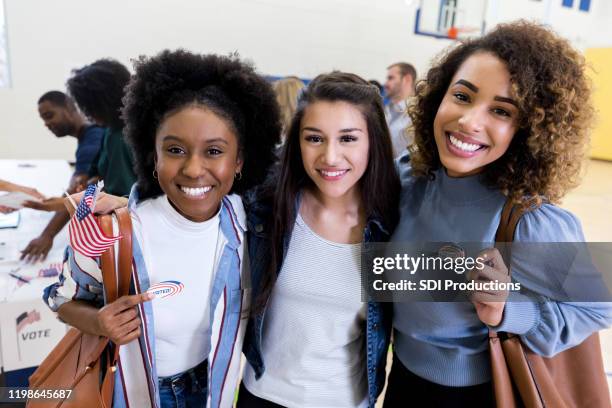 three friends are happy they went together to vote - student government stock pictures, royalty-free photos & images