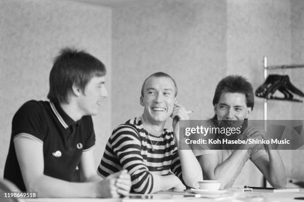 The Jam being interview in a hotel in Tokyo, Japan, 14th June 1982. L-R Paul Weller, Rick Buckler, Bruce Foxton.