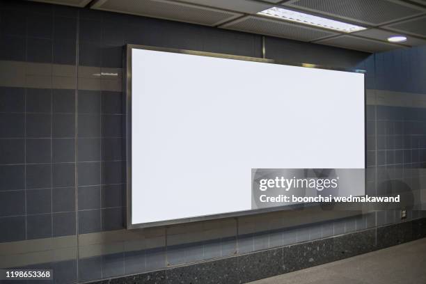 subway billboards at subway stations - underground rail stockfoto's en -beelden