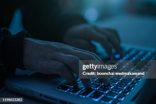 Hacker using laptop. Hacking the Internet. Hacker using laptop. Hacking the Internet.