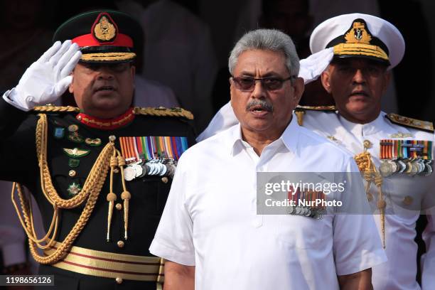 Sri Lankan President Gotabaya Rajapaksa sings Sri Lankan national anthem accompanied by Sri Lankan Army Commander Shavendra Silva , Sri Lankan Navy...