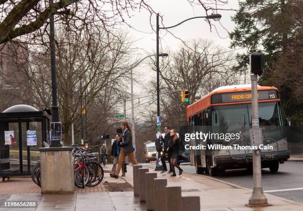 Students and faculty step off a bus on campus at Princeton University on February 4, 2020 in Princeton, New Jersey. The university said over 100...