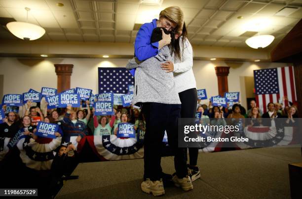 Elizabeth Warren embraces her grandchildren Atticus and Lavinia as she arrives at a Caucus Rally in Des Moines, IA on Feb. 3, 2020. The Iowa...