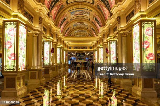 Staffs walk in hallway of The Venetian Macau after the closing of its casino on February 5, 2020 in Macau, China. Macau government announced to close...