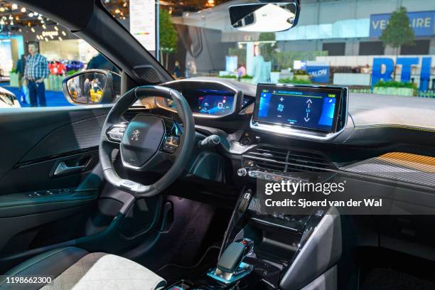 Peugeot e-208 all electric compact hatchback car interior on display at Brussels Expo on JANUARY 09, 2020 in Brussels, Belgium. The Peugeot 208 is...