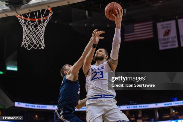 Seton Hall Pirates forward Sandro Mamukelashvili drives to the basket during the second half of the college basketball game between the Xavier...