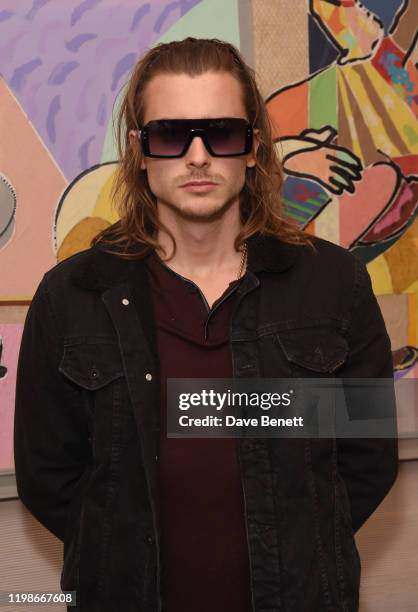 Elijah Rowen attends a private view of Olivier Mourao's new exhibition 'Painting With Paper' at Mount Gallery on February 4, 2020 in London, England.