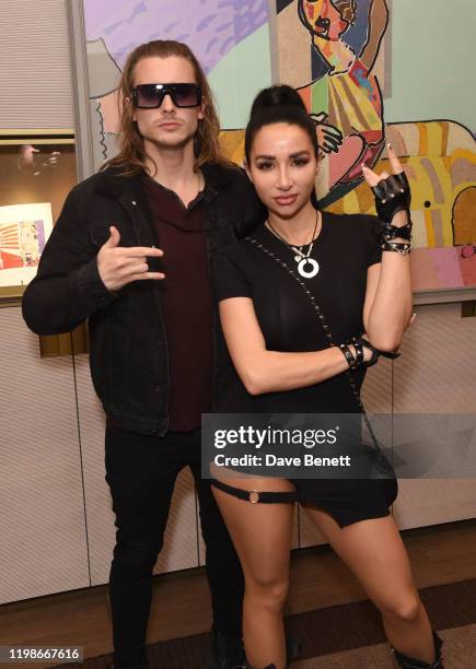 Elijah Rowen and Natasha Grano attend a private view of Olivier Mourao's new exhibition 'Painting With Paper' at Mount Gallery on February 4, 2020 in...