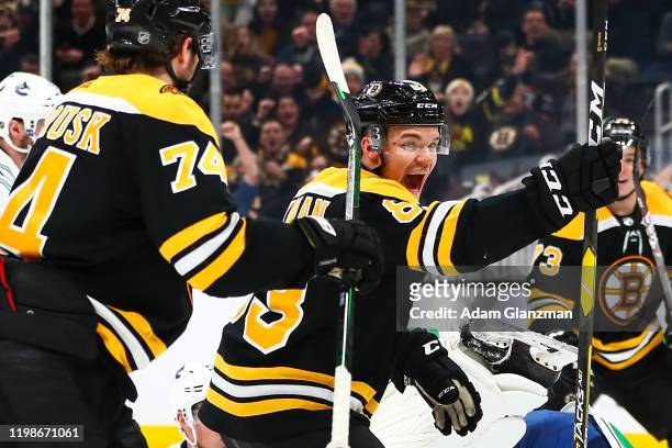 Karson Kuhlman of the Boston Bruins reacts after scoring a goal in the third period of a game against the Vancouver Canucks at TD Garden on February...