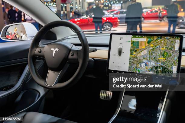 Tesla Model 3 compact full electric car interior with a large touch screen on the dashboard on display at Brussels Expo on JANUARY 09, 2020 in...