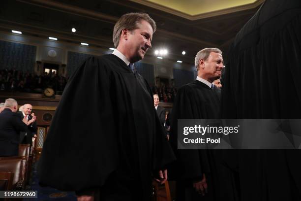 Supreme Court Associate Justice Brett Kavanaugh and Chief Justice John Roberts arrive to hear President Donald Trump deliver the State of the Union...