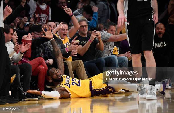 LeBron James of the Los Angeles Lakers wants a foul call on Jakob Poeltl of the San Antonio Spurs after making his fifth straight three-point basket...