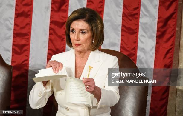 Speaker of the US House of Representatives Nancy Pelosi rips a copy of US President Donald Trumps speech after he delivers the State of the Union...