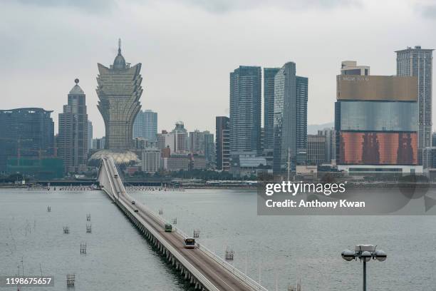 Buses drive across a bridge on February 5, 2020 in Macau, China. The Macau government announced it would close casinos for two weeks after a hotel...