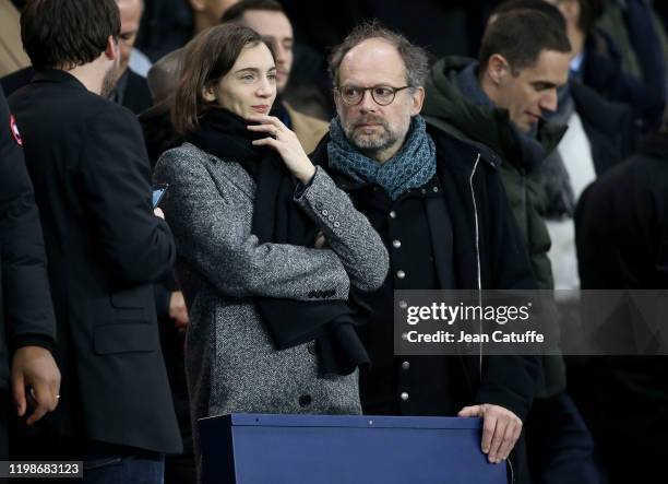 Denis Podalydes and his partner Leslie Menu attend the French League Cup quarter final between Paris Saint-Germain and AS Saint-Etienne at Parc des...