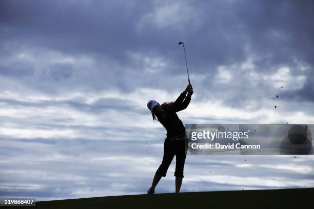 Paula Creamer of the USA plays her second shot on her first hole against the grey morning sky during the pro-am for the 2011 Ricoh Women's British...