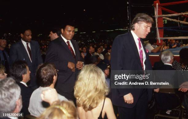 Muhammad Ali and Donald Trump attend the Evander Holyfield vs. George Foreman boxing match at the Trump Plaza Hotel and Casino.
