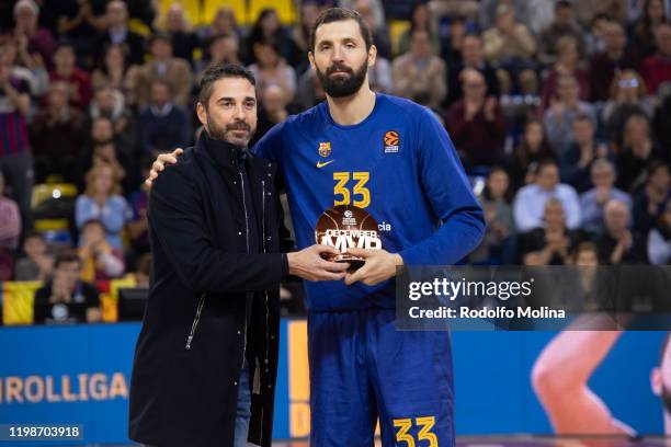 Nikola Mirotic, #33 of FC Barcelona receives from Juan Carlos Navarro, former player and legend the MVP Trophy of December prior the 2019/2020...