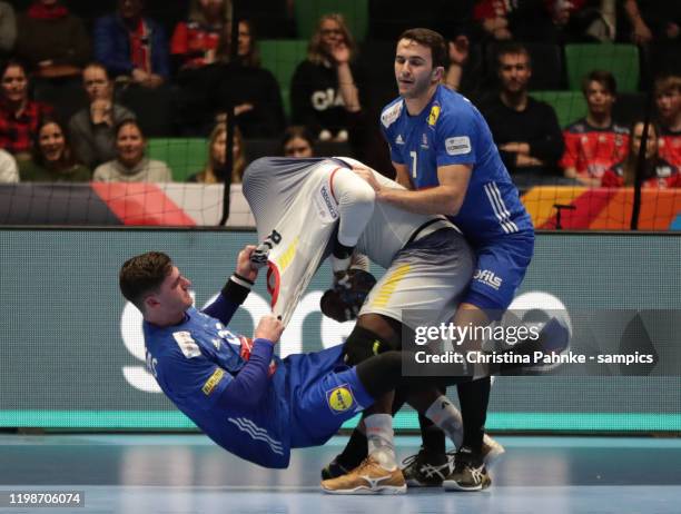 Ludovic FABREGAS of France competes with Alexis BORGES HERNANDEZ of Portugal and Romain LAGARDE of France during the Men's EHF EURO 2020 group D...