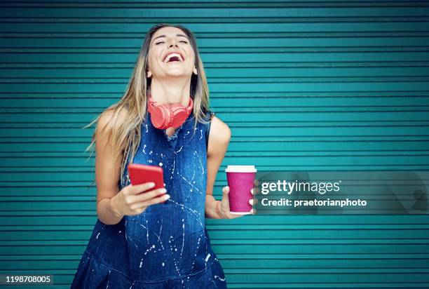 young girl is dancing and listening the music - people white background stock pictures, royalty-free photos & images