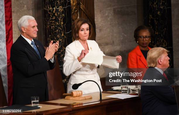 House Speaker Nancy Pelosi rips tears up her advanced copy of President Donald J. Trump's State of the Union address before members of Congress in...