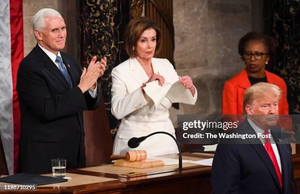 House Speaker Nancy Pelosi rips tears up her advanced copy of President Donald J. Trump's State of the Union address before members of Congress in...