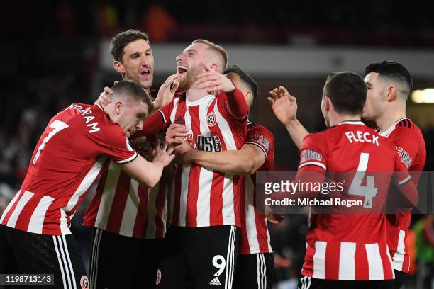 Oliver McBurnie of Sheffield United celebrates with his team after he scores his sides first goal during the Premier League match between Sheffield...