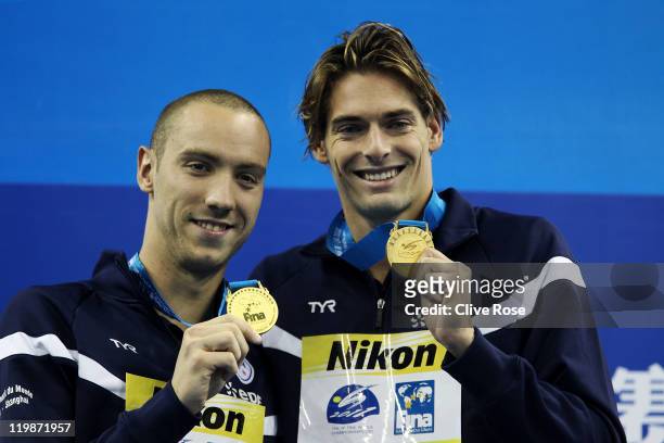 Jeremy Stravius and Camille Lacourt of France celebrate their dead heat gold medal in the Men's 100m Backstroke Final during Day Eleven of the 14th...