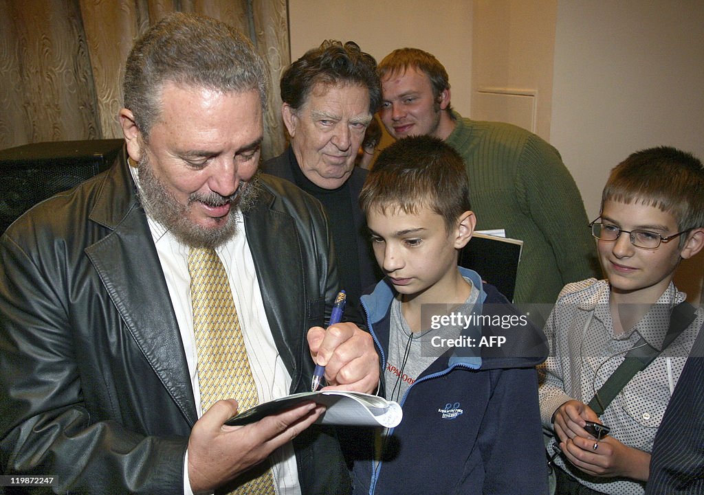 Fidel Castro Jr. signs an autograph for