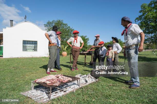 argentine gauchos relaxing outdoors and grilling - ranch house stock pictures, royalty-free photos & images