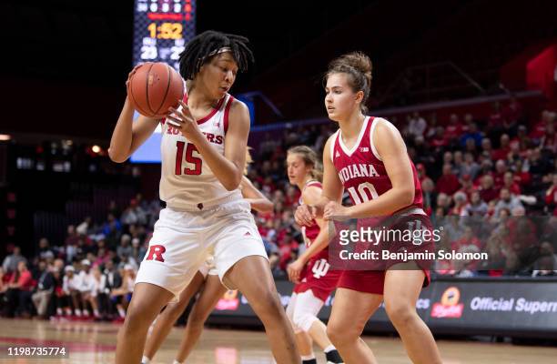 Maori Davenport of the Rutgers Scarlet Knights is guarded by Aleksa Gulbe of the Indiana Hoosiers at Rutgers Athletic Center on December 31, 2019 in...