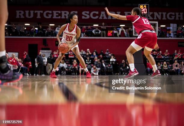 Joiya Maddox of the Rutgers Scarlet Knights is guarded by Jaelynn Penn of the Indiana Hoosiers at Rutgers Athletic Center on December 31, 2019 in...