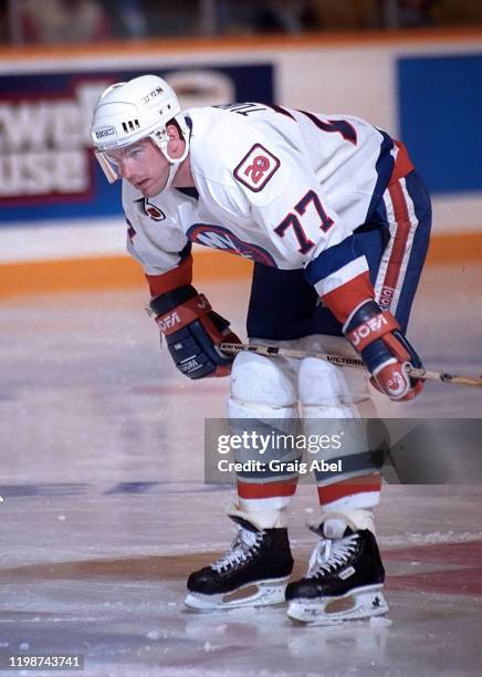 Pierre Turgeon of the New York Islanders skates against the Toronto Maple Leafs during NHL game action on April 12, 1992 at Maple Leaf Gardens in...