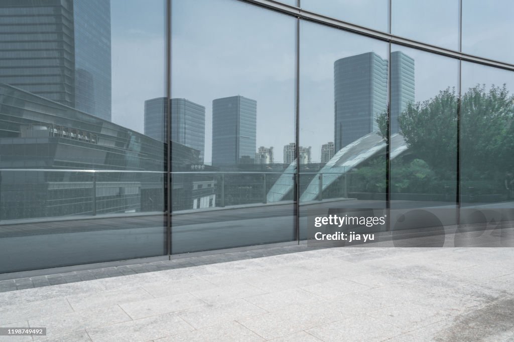 Reflection of blue curtain wall glass in modern architecture