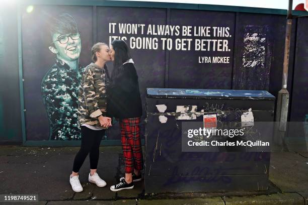 Robyn Peoples and Sharni Edwards, Northern Irelands first same-sex couple to be legally married kiss in front of the Lyra McKee mural on February 5,...