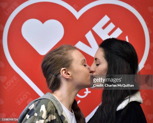 Robyn Peoples and Sharni Edwards, Northern Ireland's first same-sex couple to be legally married, kiss during a pre-wedding press conference on...