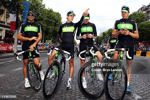 Juan Antonio Flecha, Ben Swift, Geraint Thomas and Edvald Boassan Hagen of Team SKY pose for photographs after the twenty first and final stage of Le...