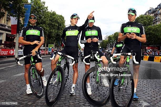 Juan Antonio Flecha, Ben Swift, Geraint Thomas and Edvald Boassan Hagen of Team SKY pose for photographs after the twenty first and final stage of Le...