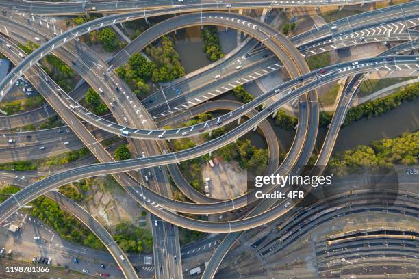 highway junction intersection and railroad tracks, brisbane, australia - queensland foto e immagini stock