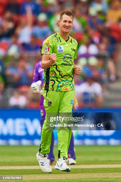 Chris Morris of the Thunder celebrates after taking the wicket of Simon Milenko of the Hurricanes during the Big Bash League match between the Sydney...