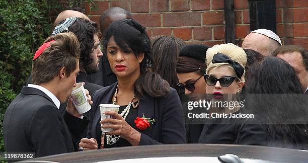 Kelly Osbourne arrives for the cremation of Amy Winehouse at Golders Green Crematorium on July 26, 2011 in London, England. Winehouse was found dead...