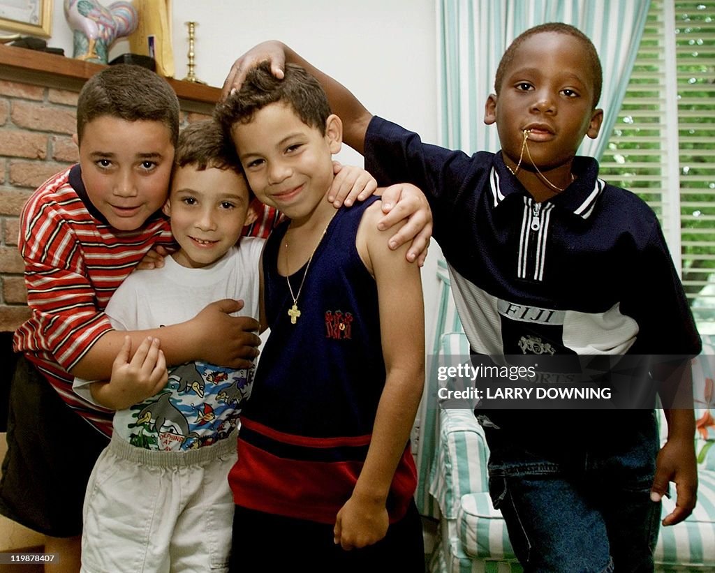 Cuban castaway Elian Gonzalez (2nd-L) po