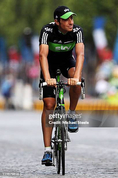 Xavier Zandio of team Team SKY takes part in a victory parade after the twenty first and final stage of Le Tour de France 2011, from Creteil to the...