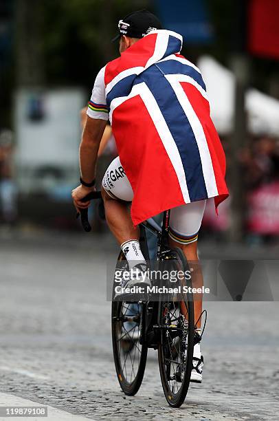 Thor Hushovd of team Garmin Cervelo takes part in a victory parade after the twenty first and final stage of Le Tour de France 2011, from Creteil to...