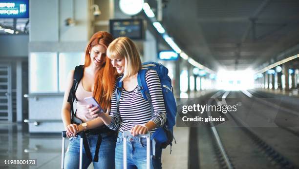 waiting for a train. - vacation train stock pictures, royalty-free photos & images