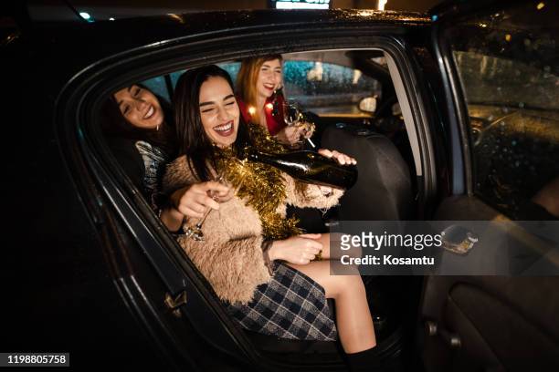 drunk women party at the back-seat of uber - girls night stock pictures, royalty-free photos & images