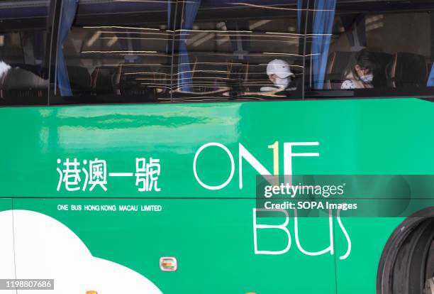 Passengers wearing protective mask on the bus to Macau. Chief Executive Carrie Lam said on Monday that all border crossings would be closed except...