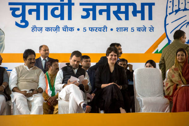 Rahul Gandhi, leader of Indian National Congress, speaks to his sister Priyanka Gandhi, general secretary of the Indian National Congress during...