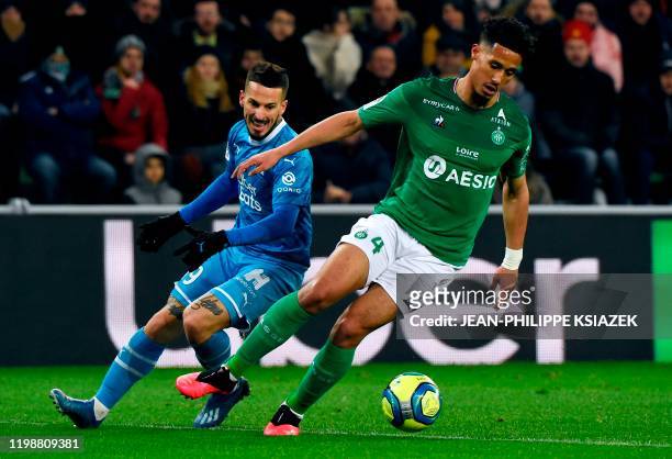 Marseille's Argentinian forward Dario Benedetto vies for the ball with Saint-Etienne's French defender William Saliba during the French L1 football...